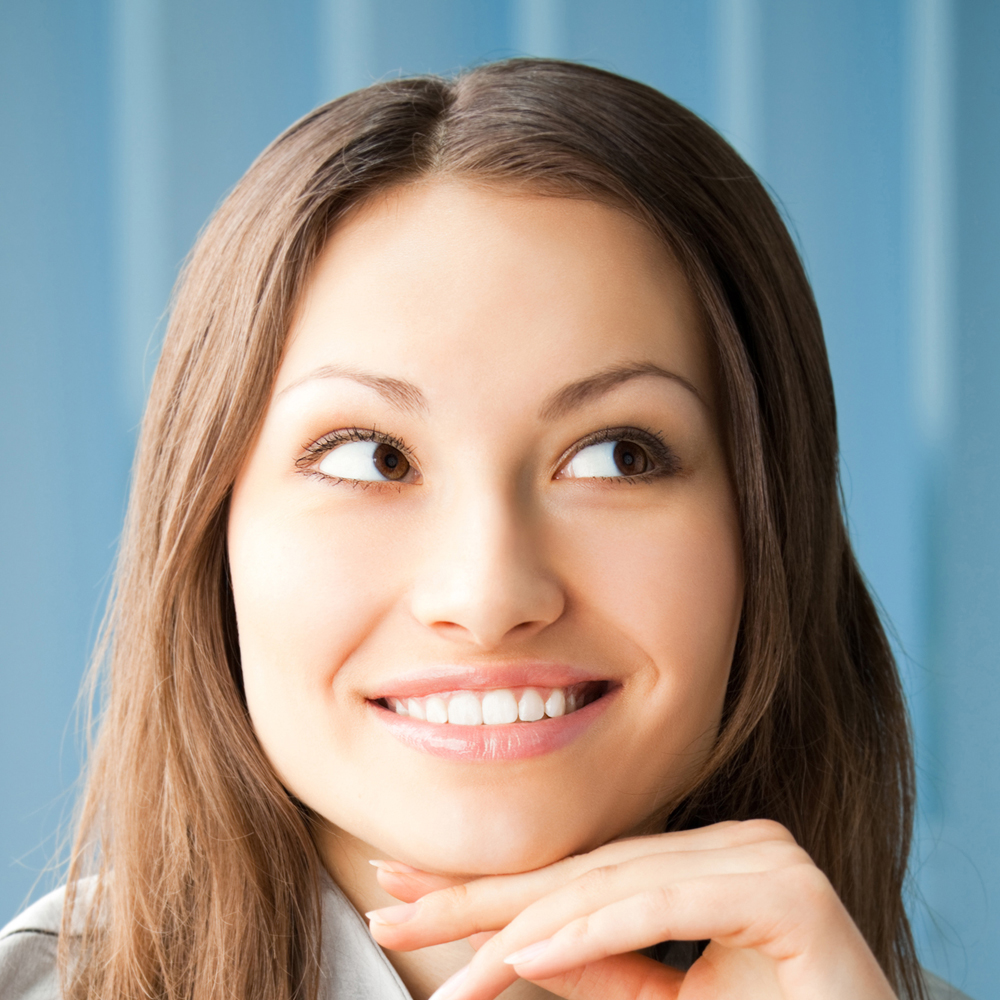 Thinkihg smiling young businesswoman
