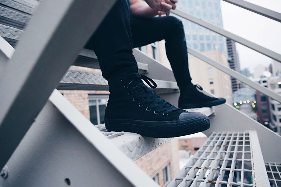 man in black sneakers